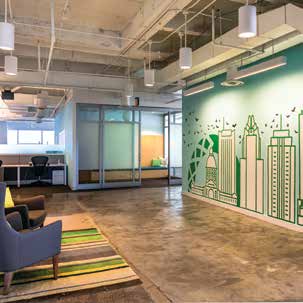 an office with a green wall and chairs