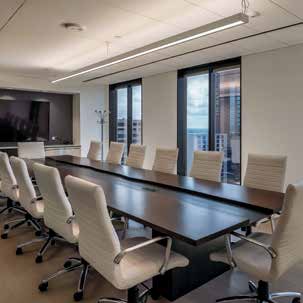 a conference room with a large table and chairs