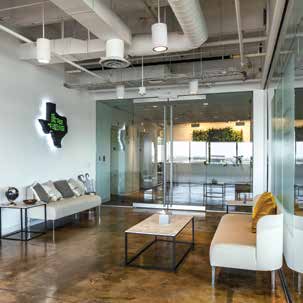 a modern office with a large glass wall